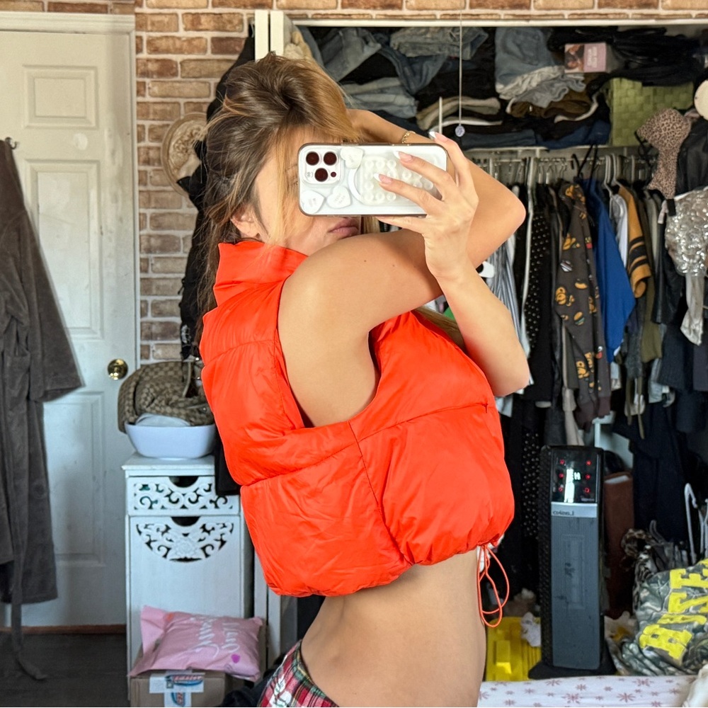 Orange puffer vest with drawstring waist #puffer #winterwear